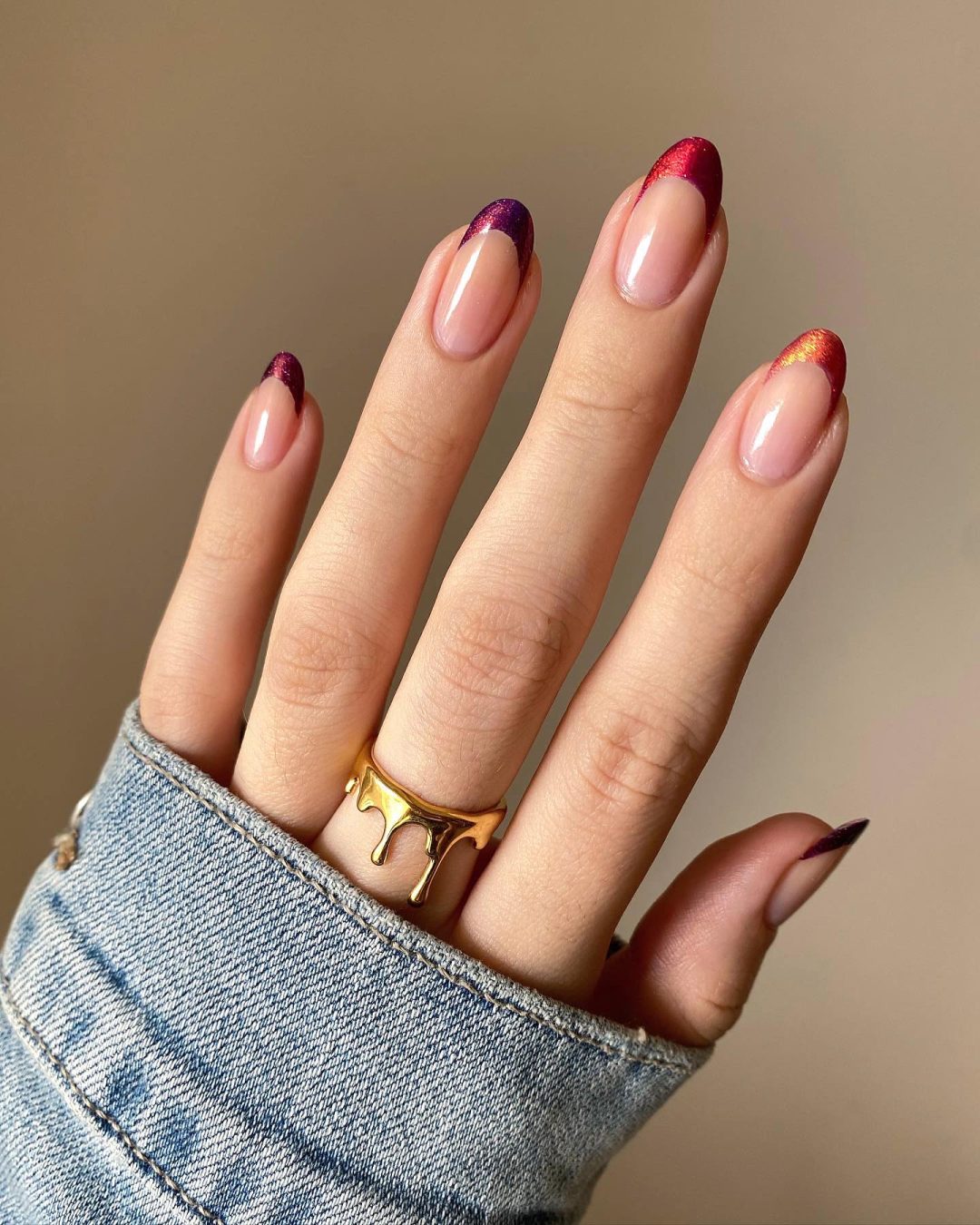 Autumnal French tip nails in almond shape.