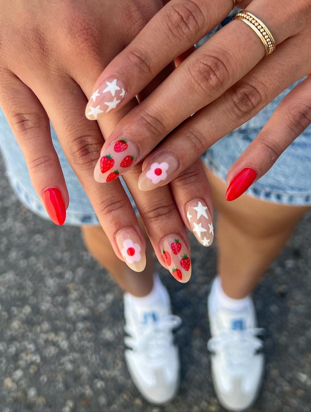 Red mix and match strawberry nails.