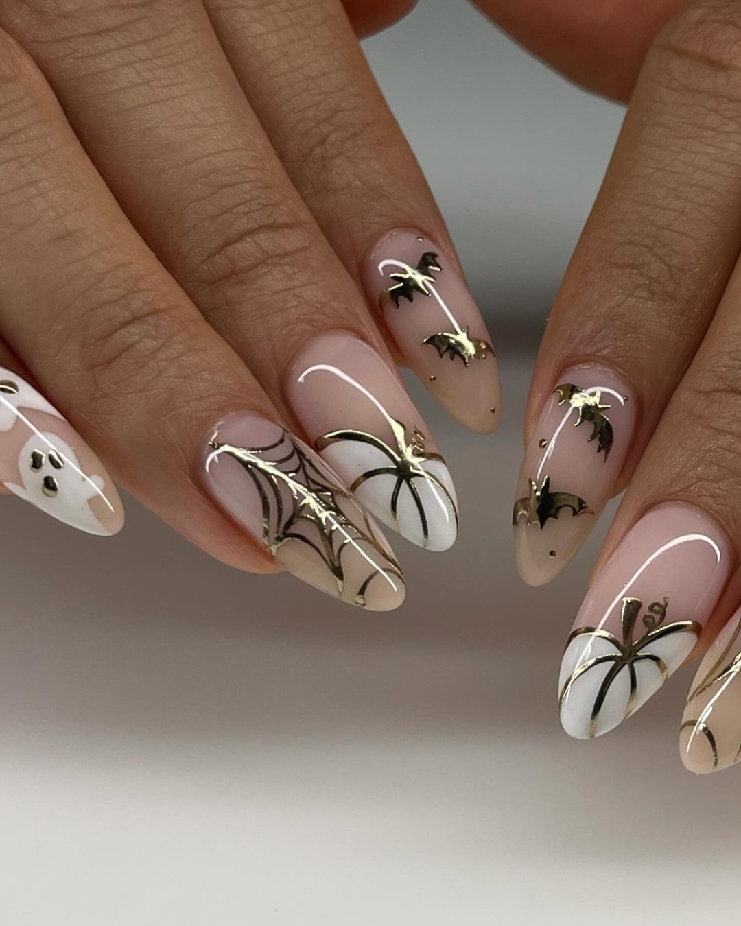 All white Halloween nails with pumpkins