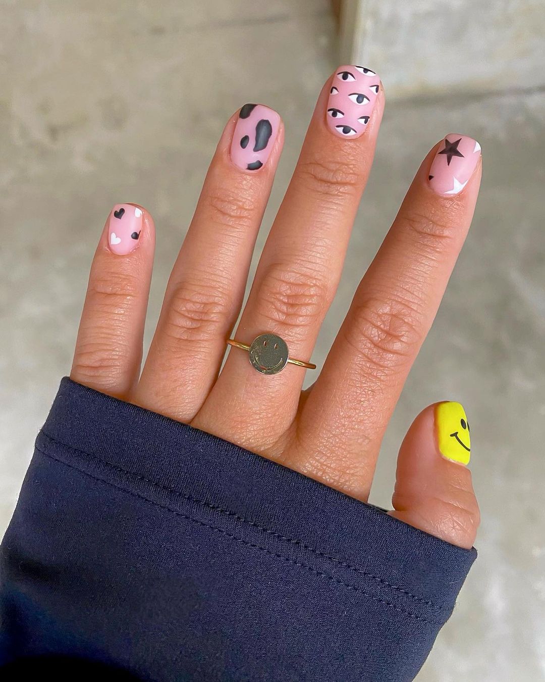 Short abstract black and white nails with yellow.