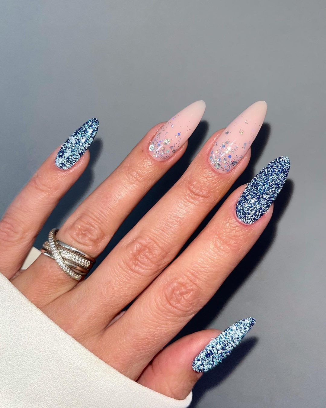 Blue glitter nails.