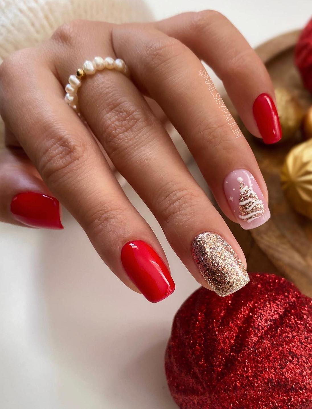 Red and gold Christmas nails with Christmas tree design.