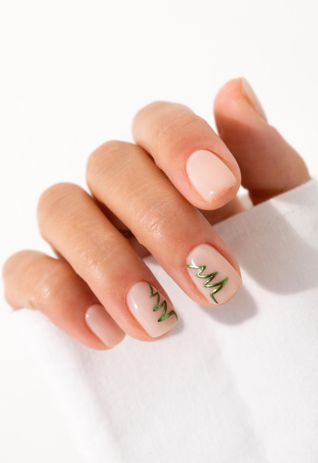 Short clear Christmas nails with Christmas tree nail art.