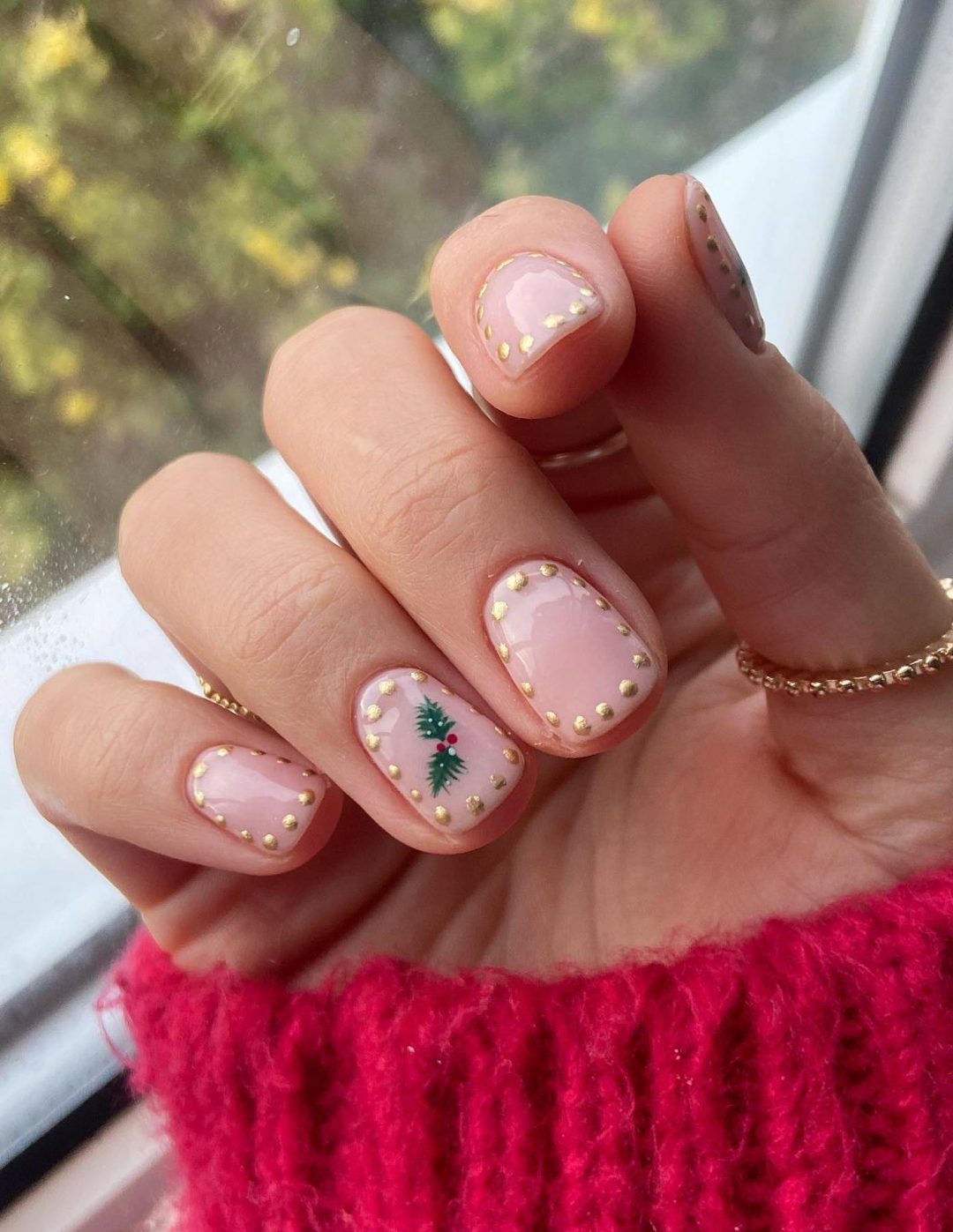 Minimalist clear Christmas nails with a mistletoe.