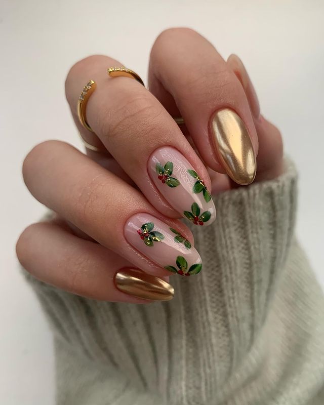 Gold nails with mistletoe nail art.