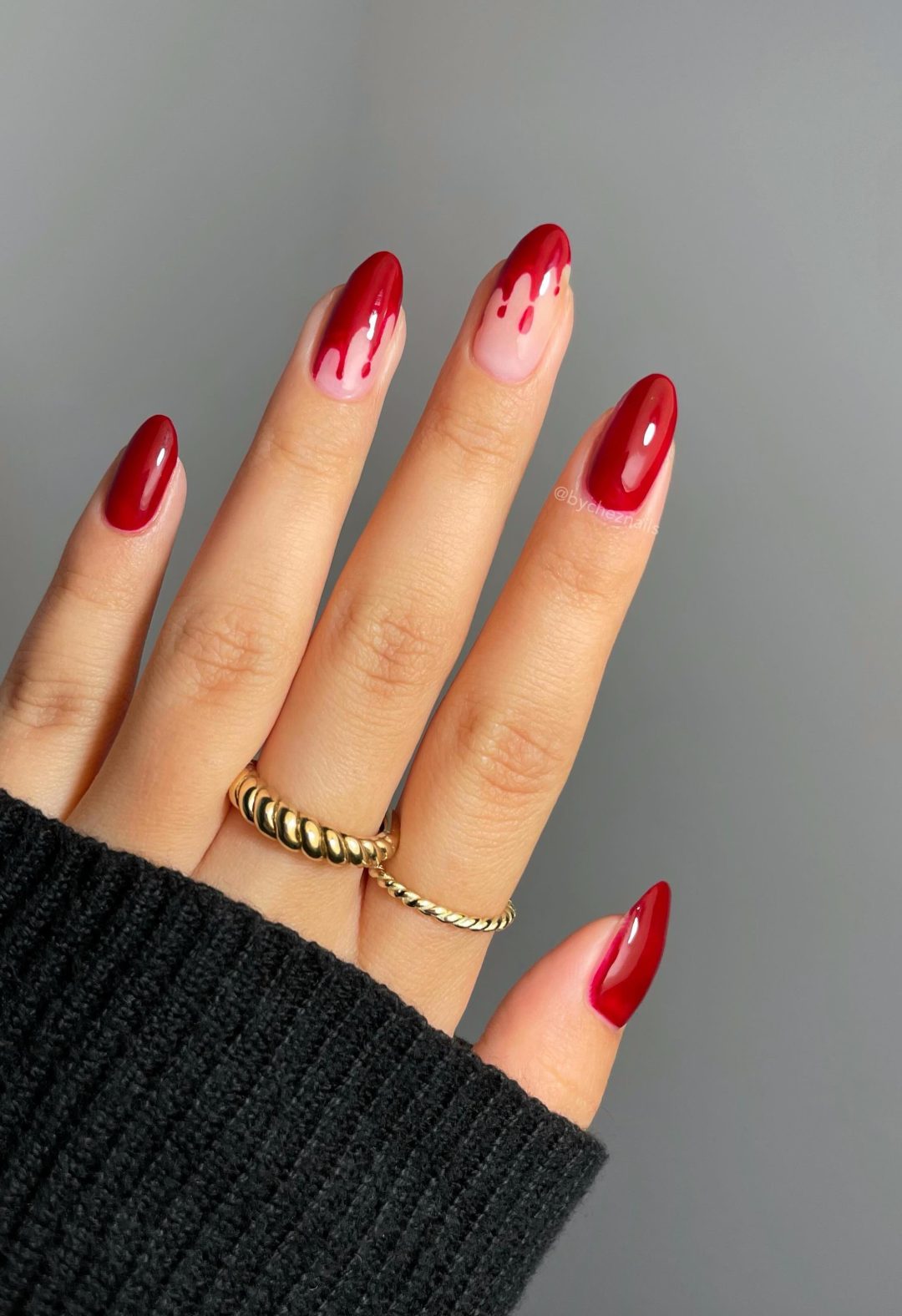 Red Halloween nails with dripping blood.