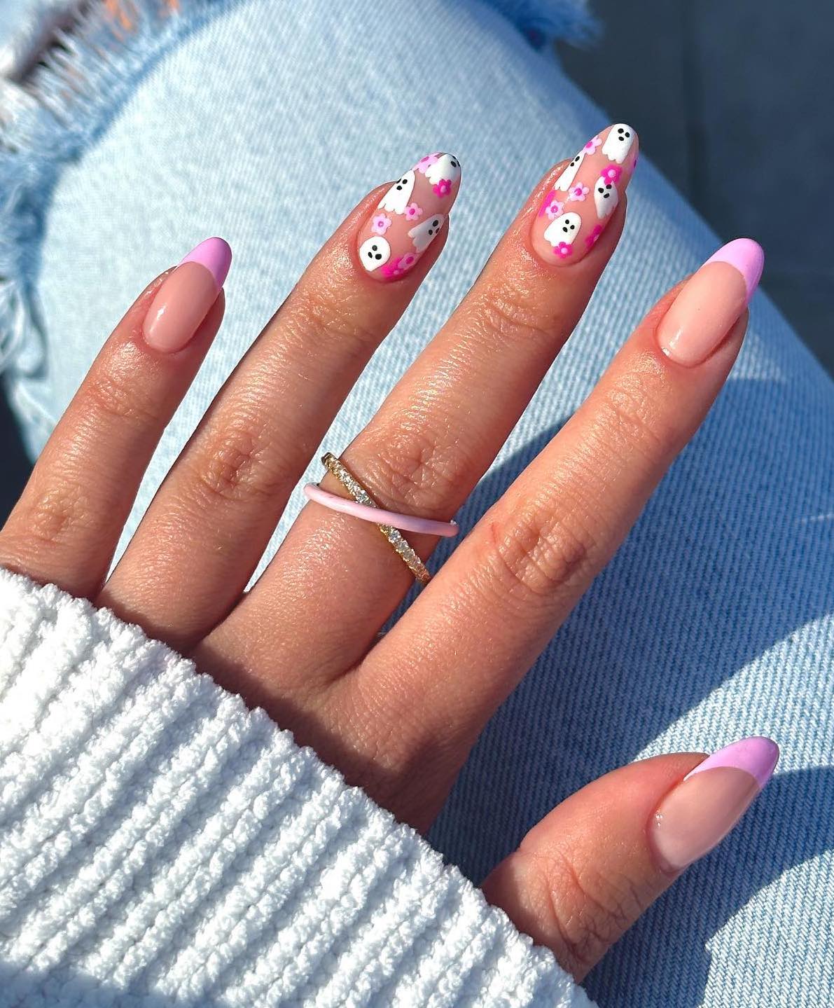 Pink French tip nails with ghosts.