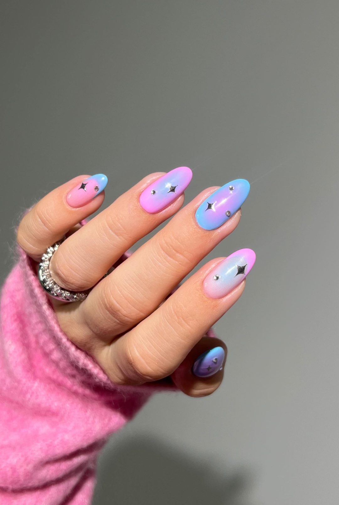 Pink and blue nails with stars.