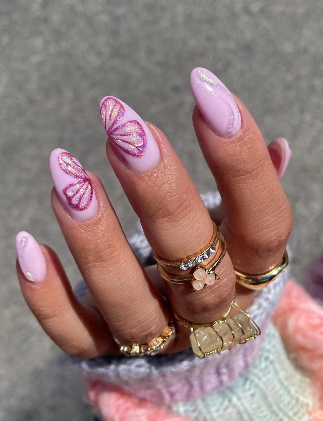 Lavender nails with butterfly nail art.