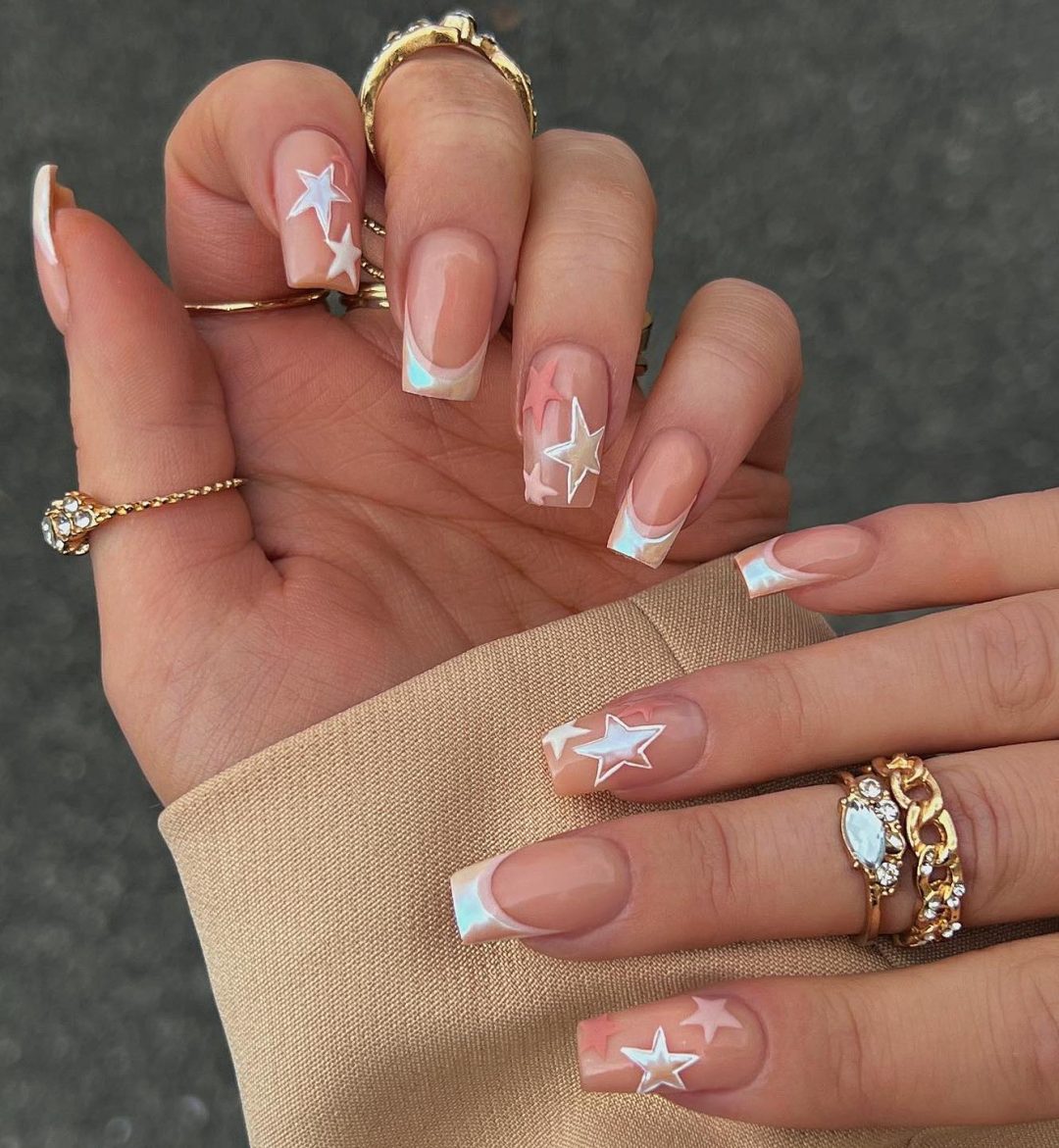 Beige chrome nails with stars.