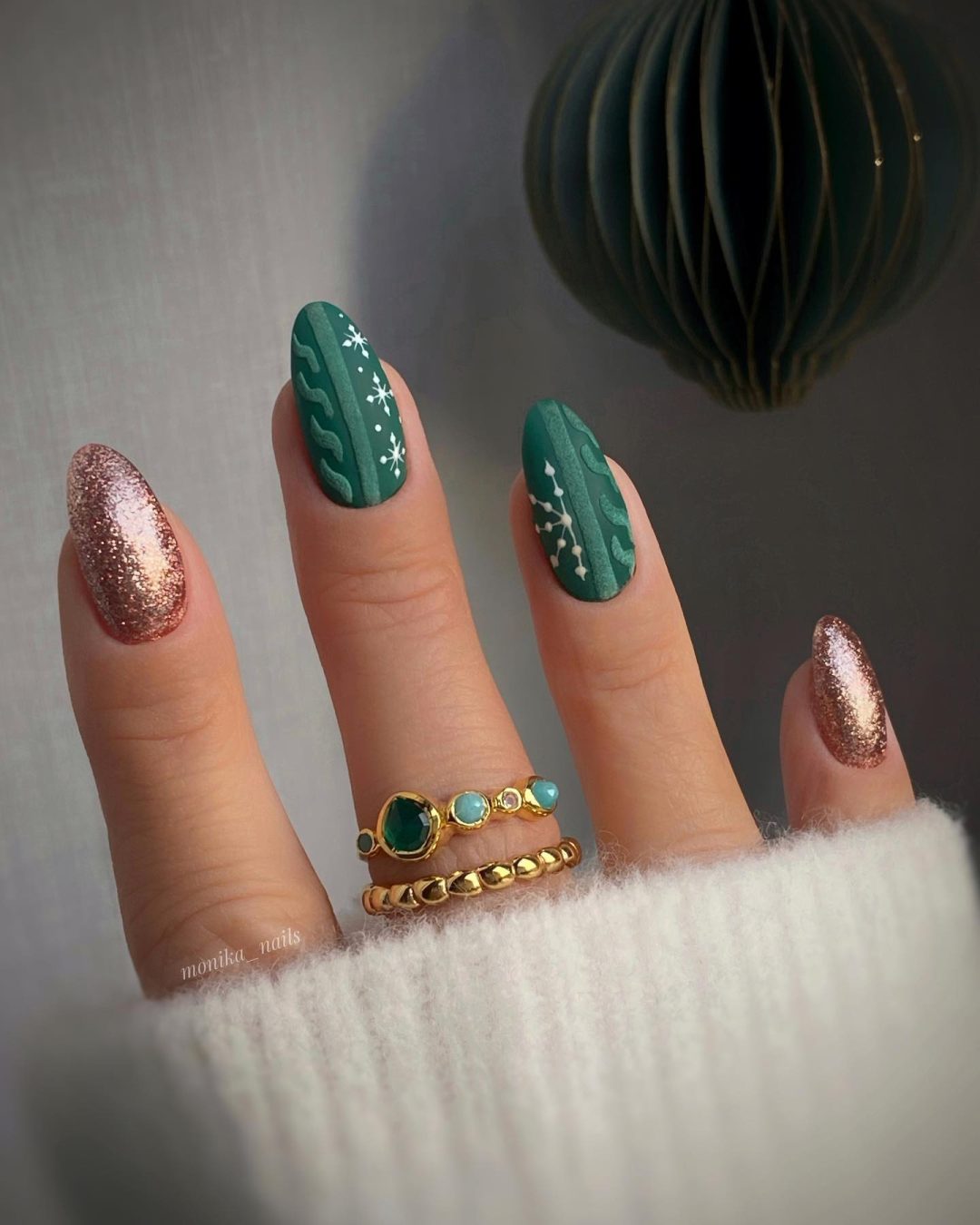 Emerald green sweater nails with rose gold glitter.