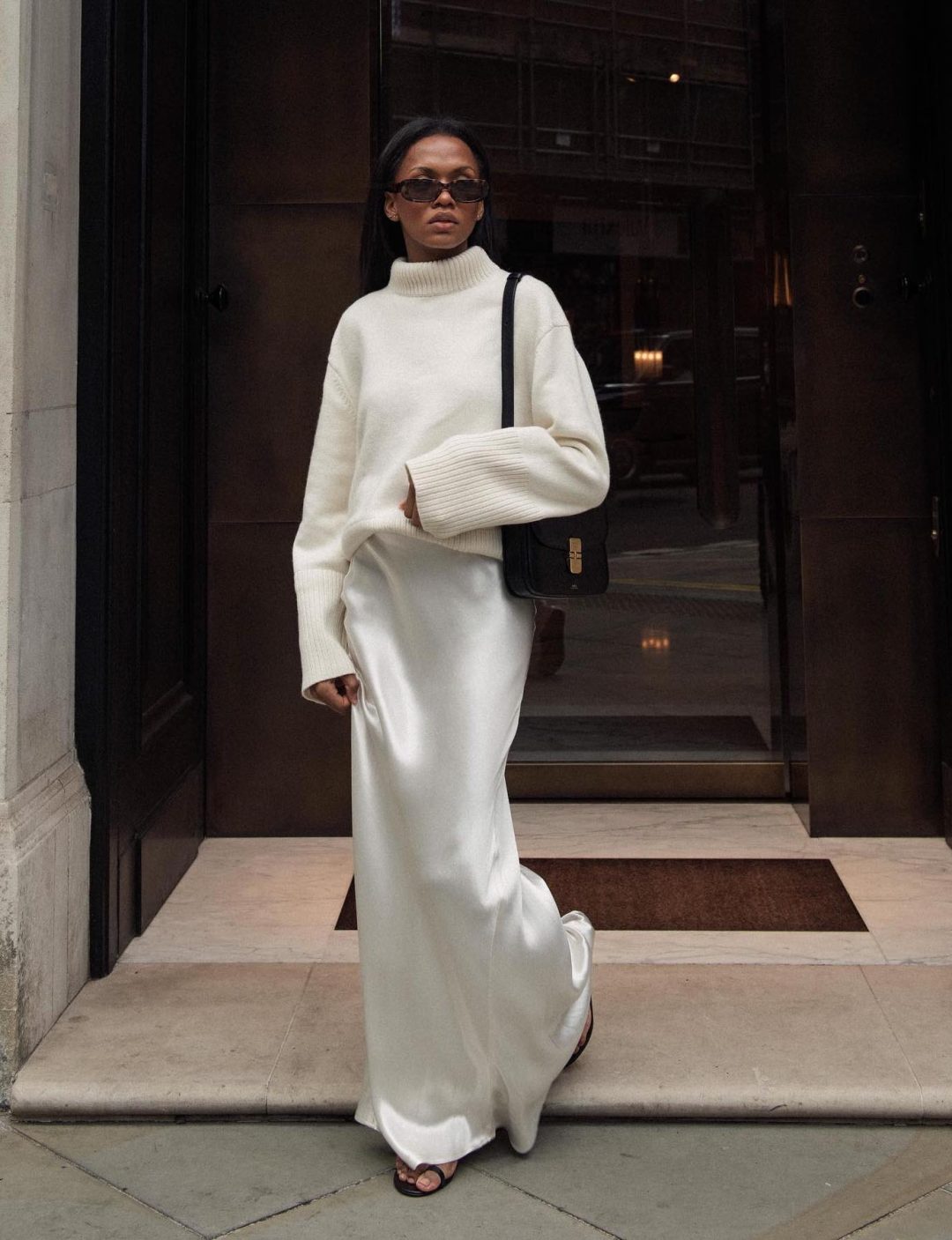 White satin maxi skirt outfit with a white sweater.