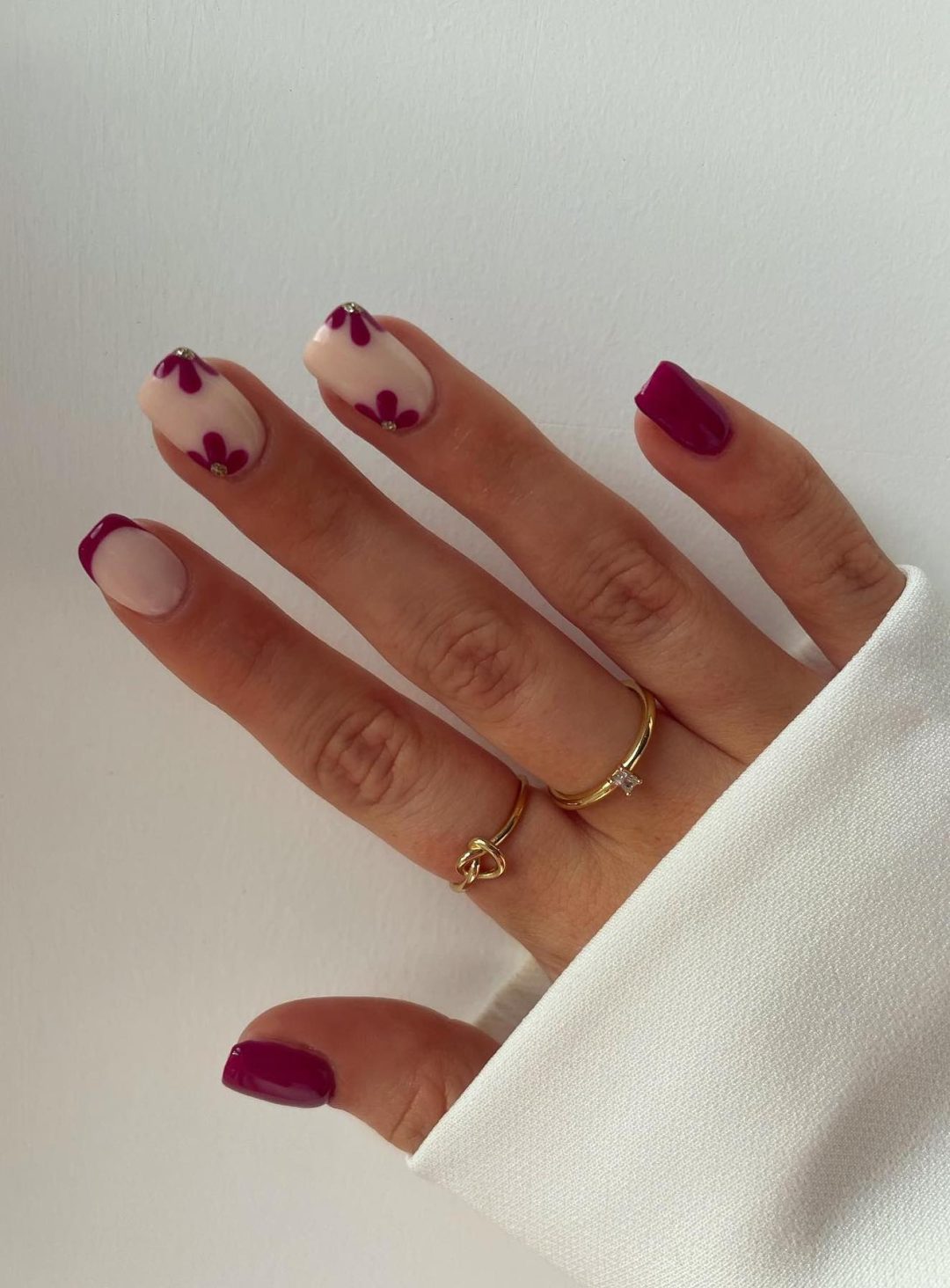 Plum fall nails with flowers and French tips.