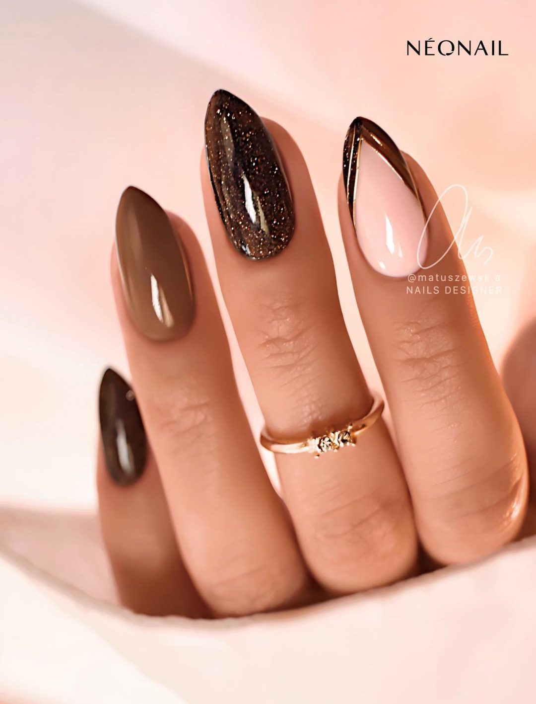 Brown nails with glitter.