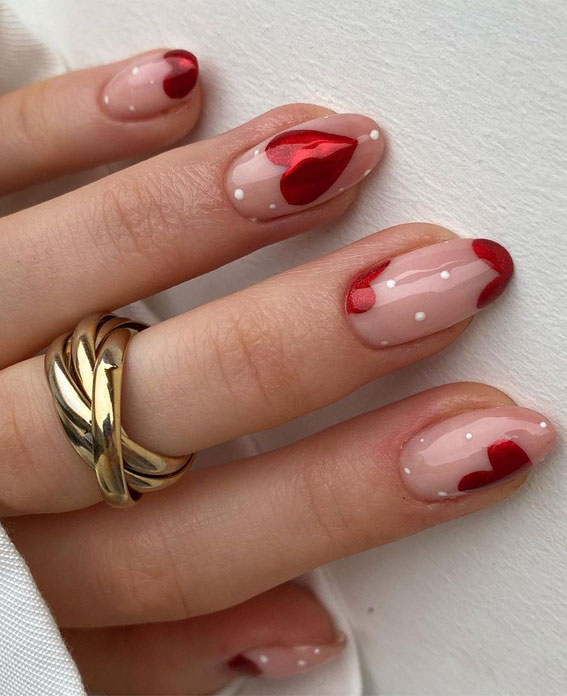 Clear base nails with red hearts.