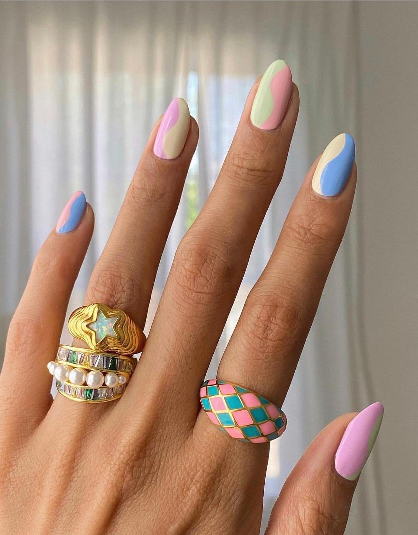 Colorful pastel swirl nails.