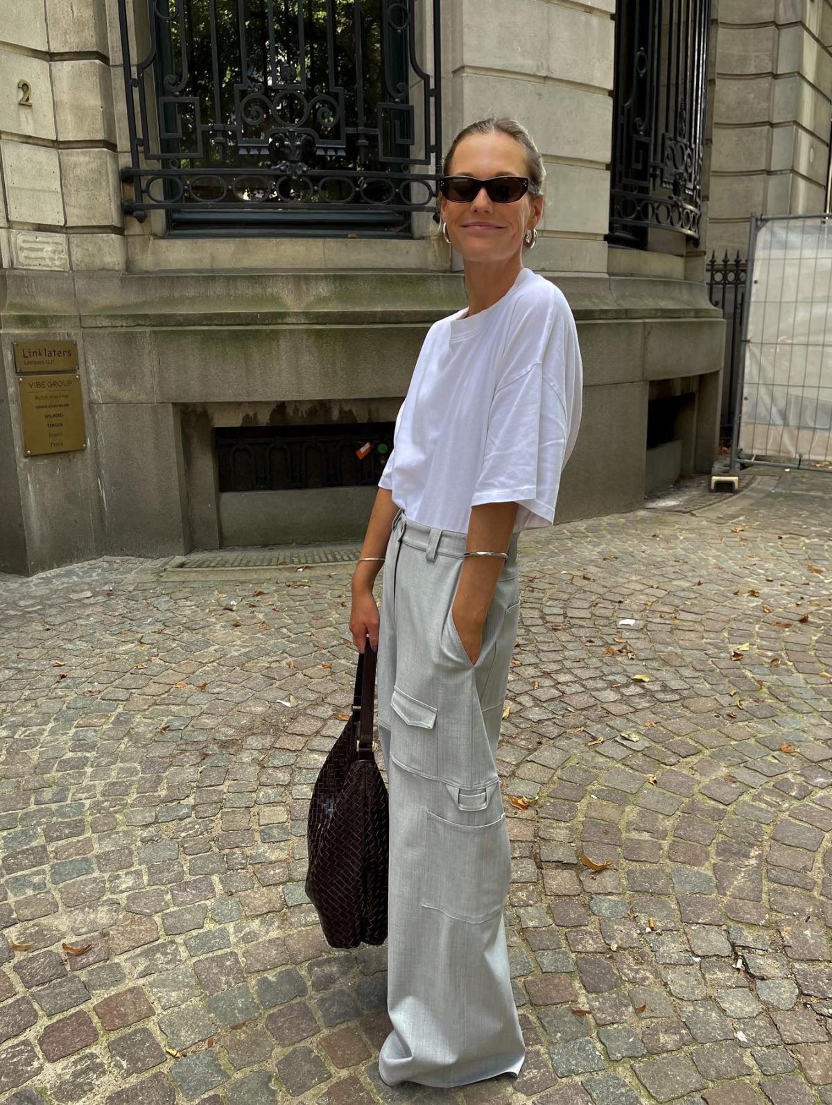 Casual outfit with light grey cargo pants and an oversized tee.