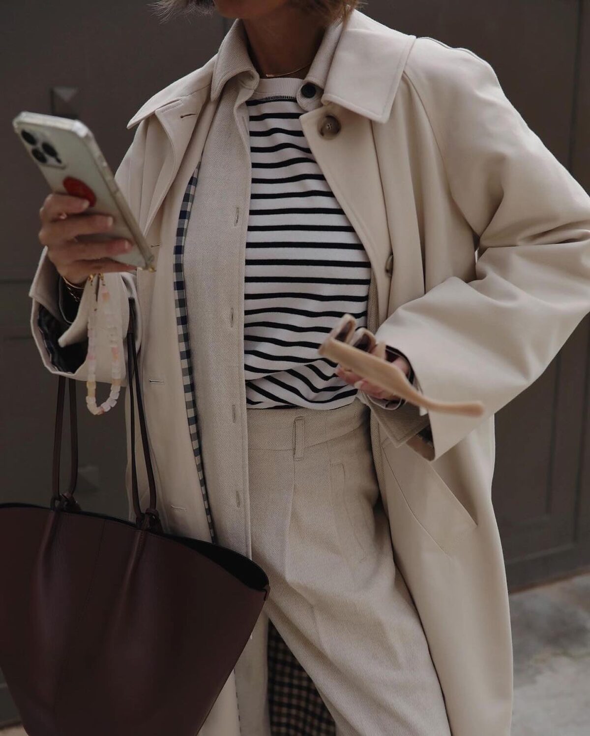 Parisian outfit with a striped t-shirt, beige overshirt and beige pants