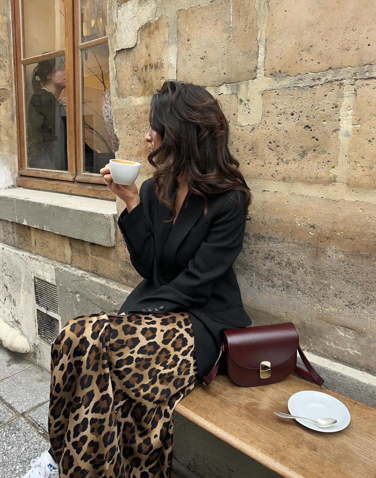 Long leopard print maxi skirt with a black blazer and burgundy bag