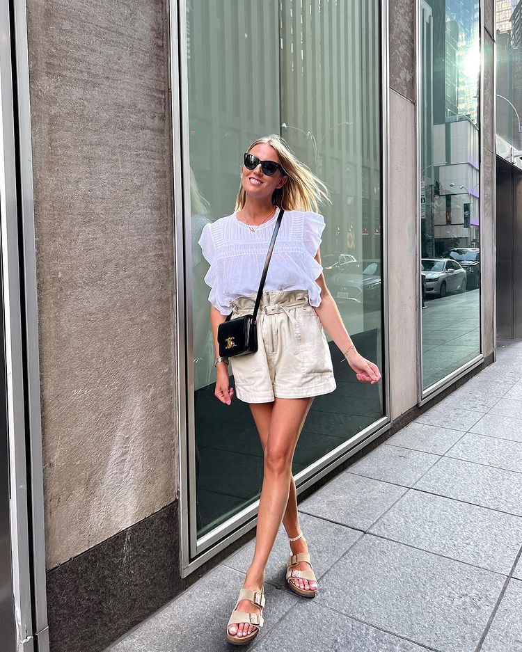 Chic beige paperbag shorts outfit with beige Birkenstock Arizona sandals and Celine bag