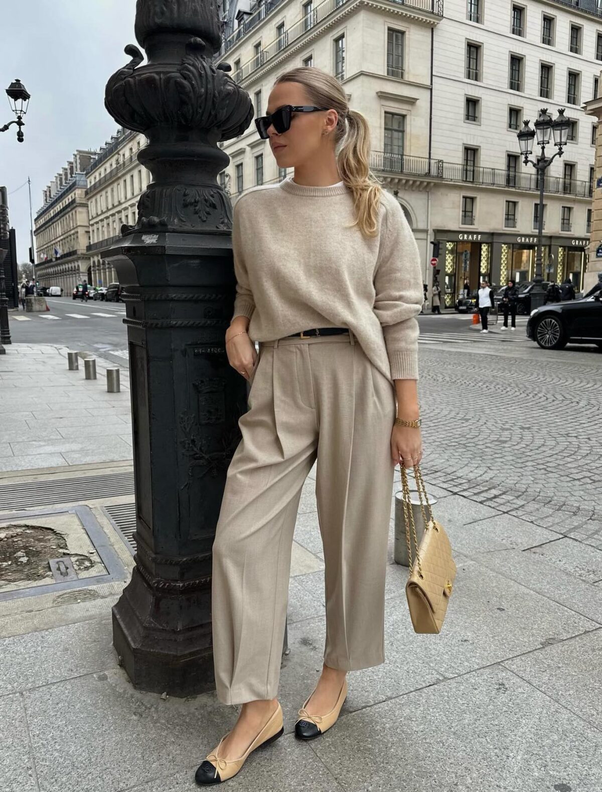 Chic beige old money outfit with wide-leg pants a sweater and ballet flats