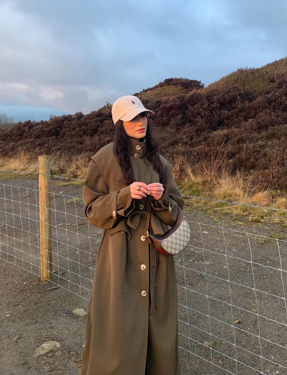 Chic countryside outfit with a khaki green trench and Gucci Ophidia bag.