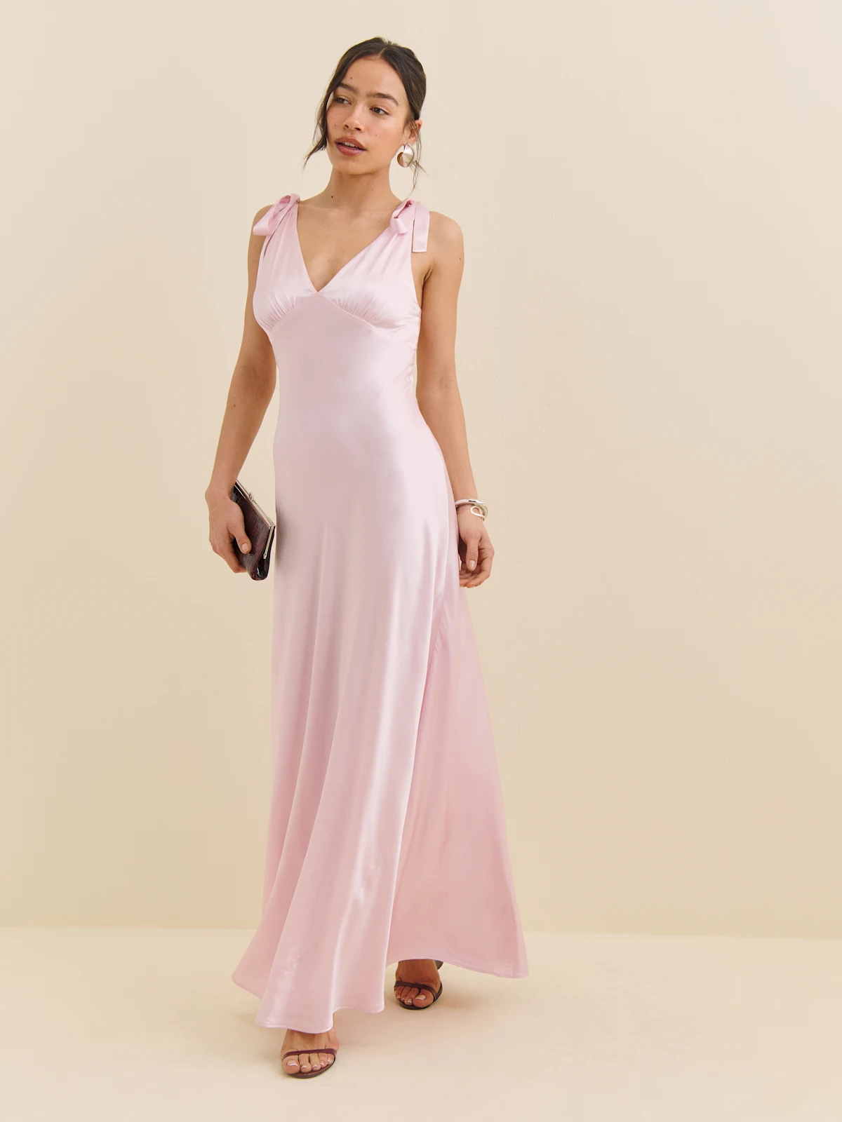 Light pink silk dress with bows.